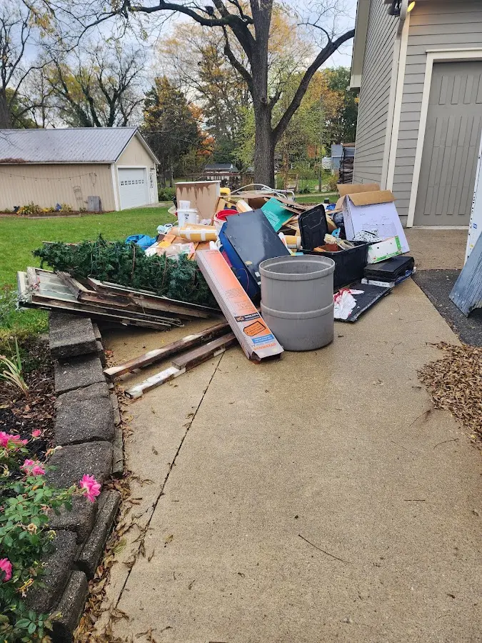 Dumpster being loaded with debris for 3 Yard Dumpster Rental in Middleburgh
